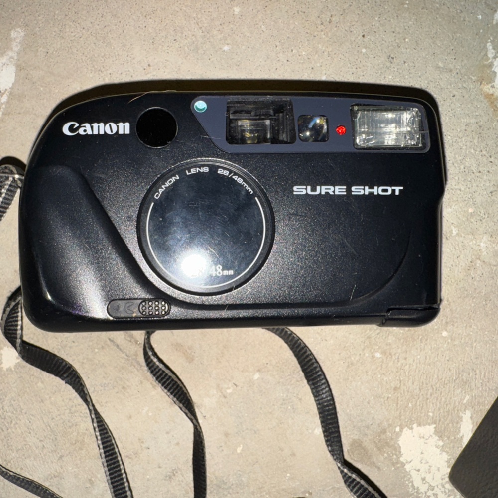 Canon sure shot prima twin 35mm point and shoot. Tested with working battery.